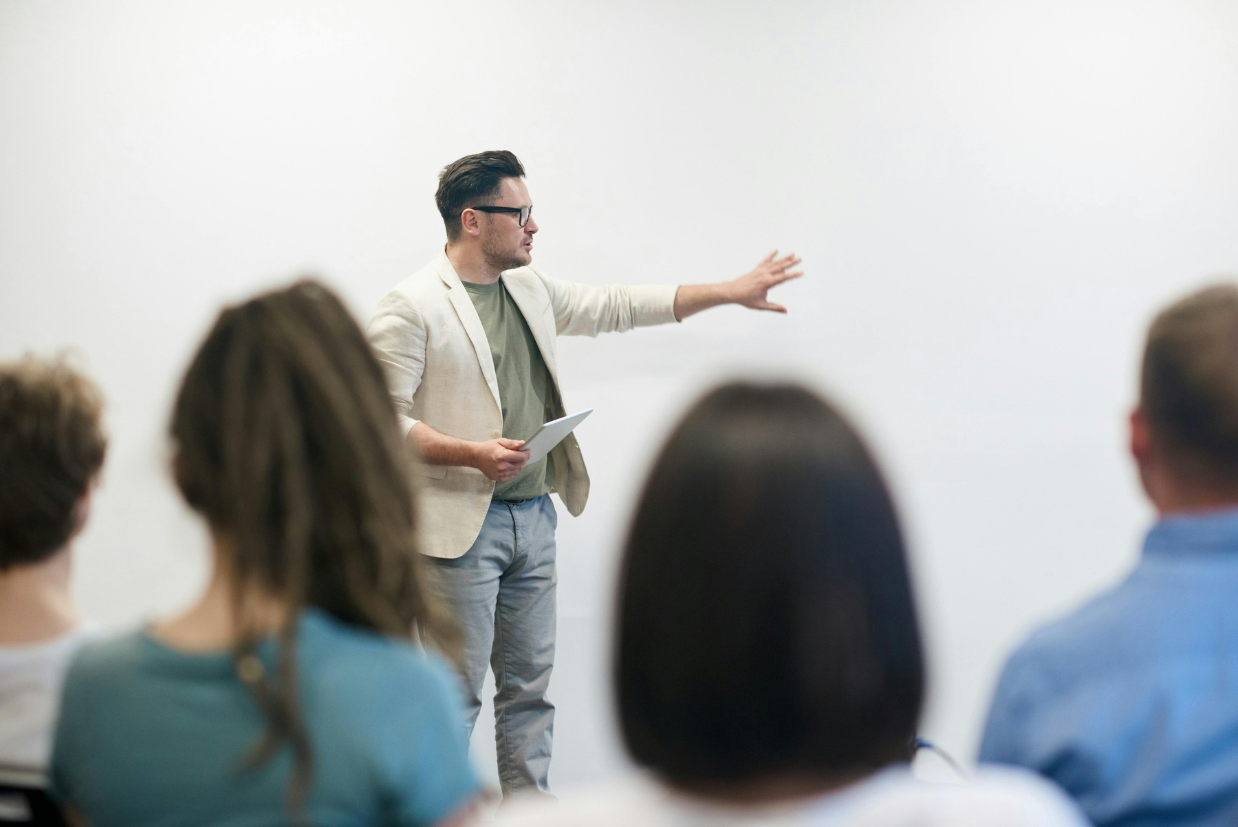 a person giving a presentation in front of a group of people